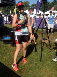 Right after the finish, when I really wanted to sit down and my paparazzi mother wanted a few pictures. This shot makes me laugh - and tells the honest story. Hot, sweaty, and slightly disoriented, I am a Ironman 70.3er!